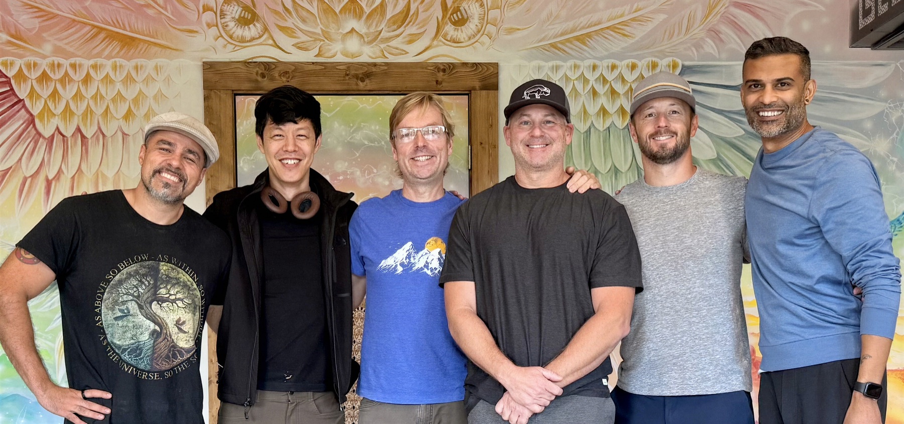 Men at the spring retreat in Asheville, laughing together outdoors